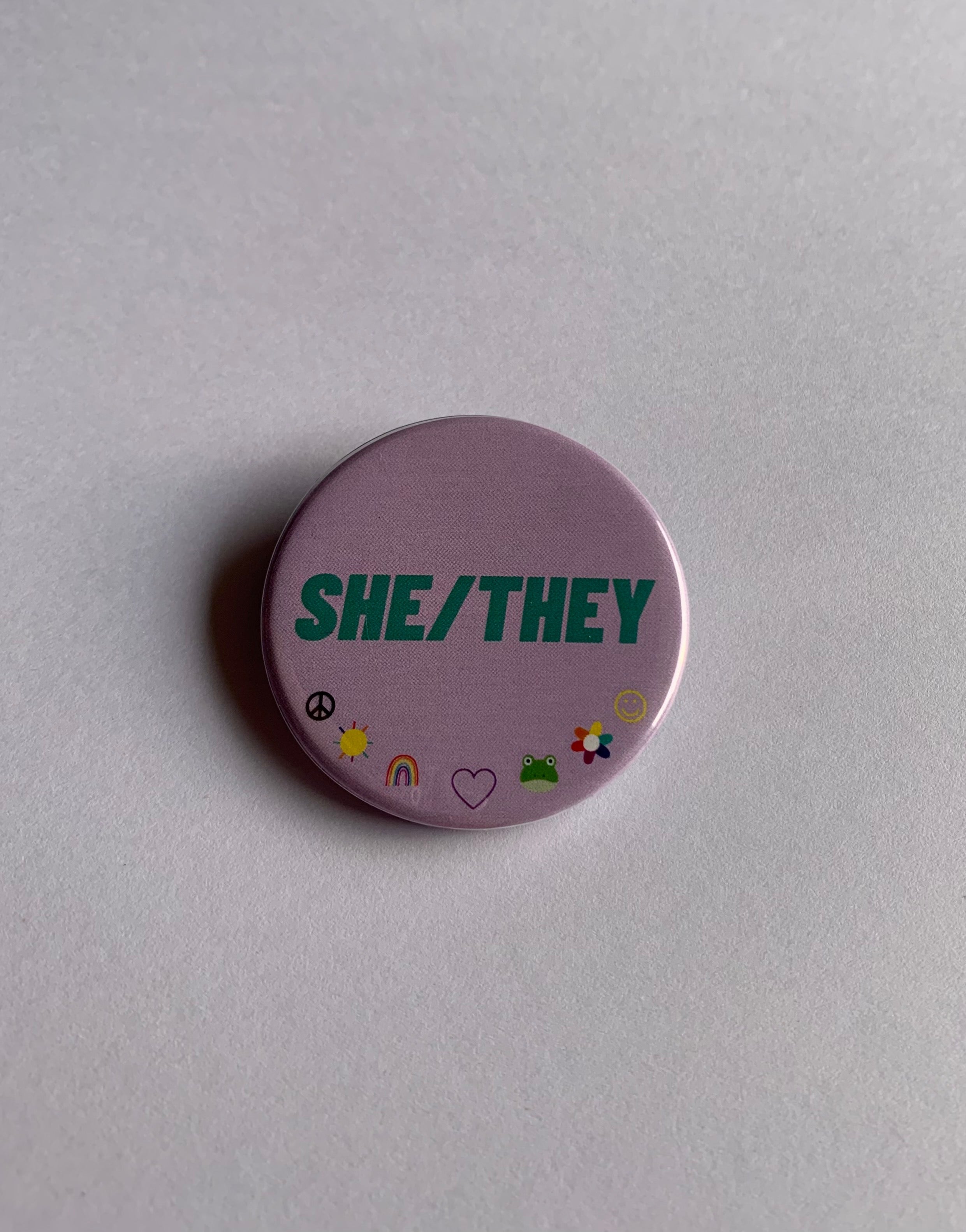 She/They Pronouns- Button Badge